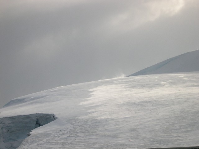 A gust front whipping up a snow devil