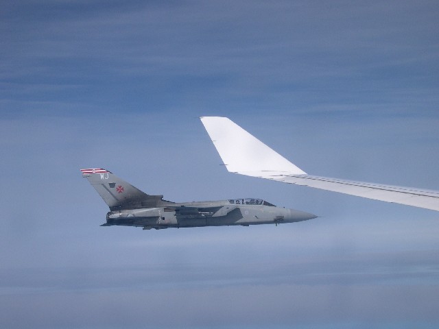 RAF Tornado at the wingtip of the Airbus